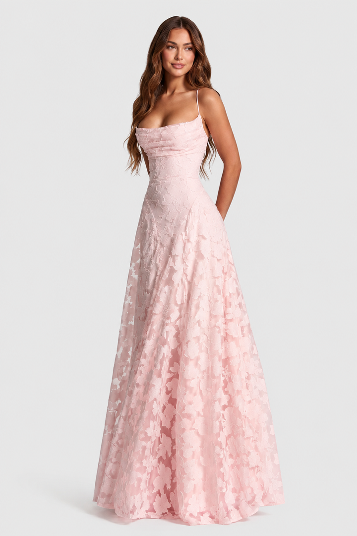 Pale pink raised floral lace dress with a draped neckline and flowing skirt, another view.