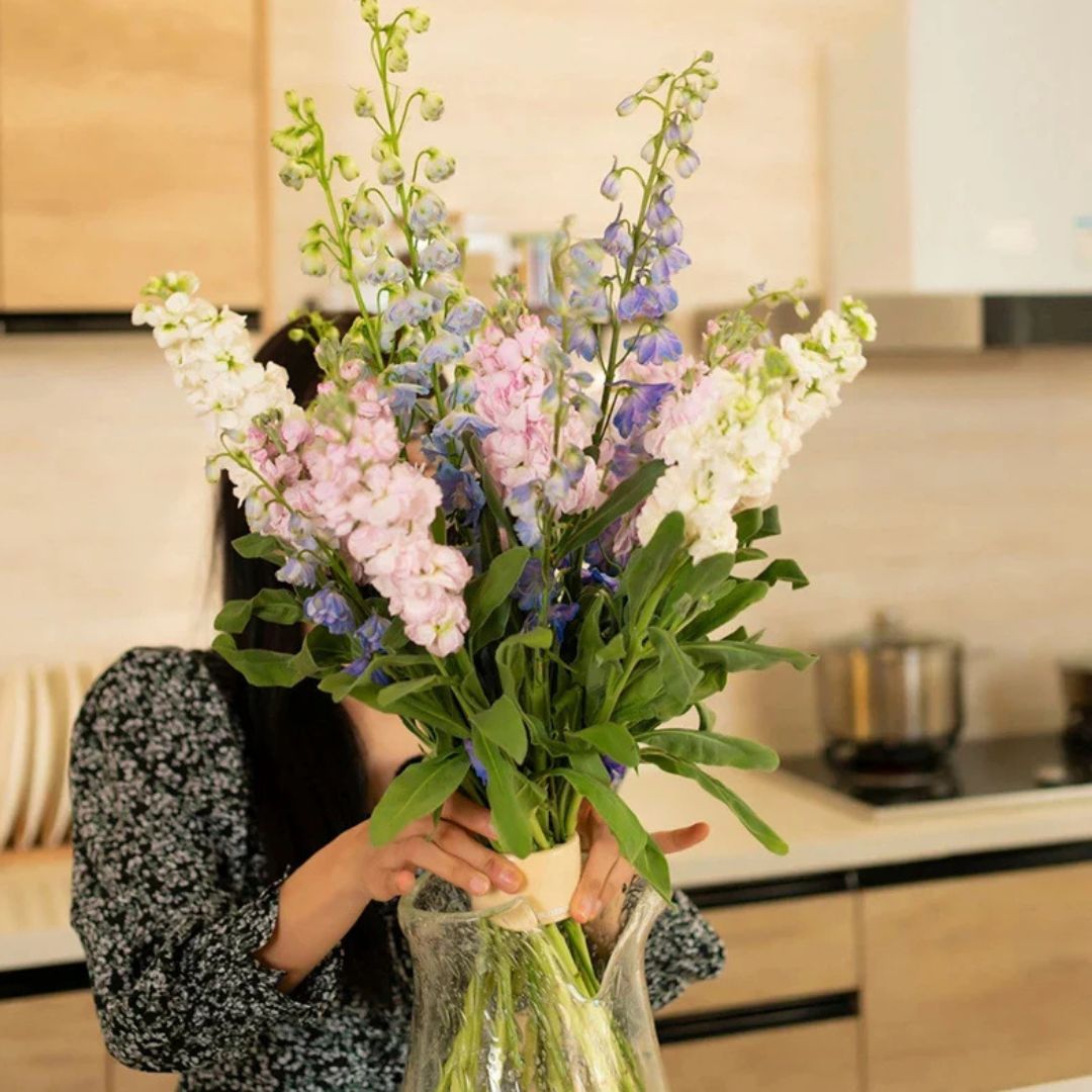 Beige flower arranger vase insert holding a bouquet upright at the vase neck