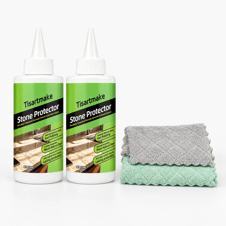 Two coating liquid bottles standing next to a folded gray cloth and a folded green cloth 24