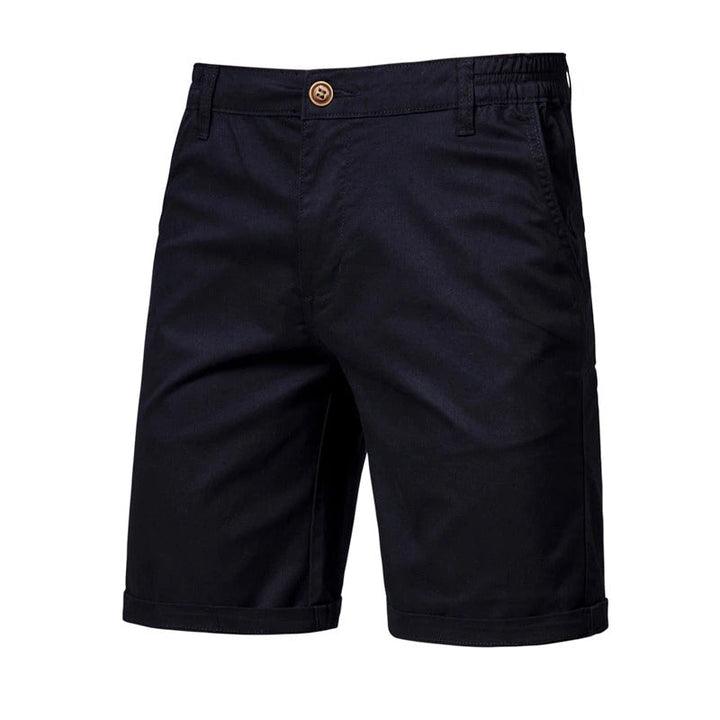 Front view of black shorts with a brown button, elastic side waist and rolled cuffs 6