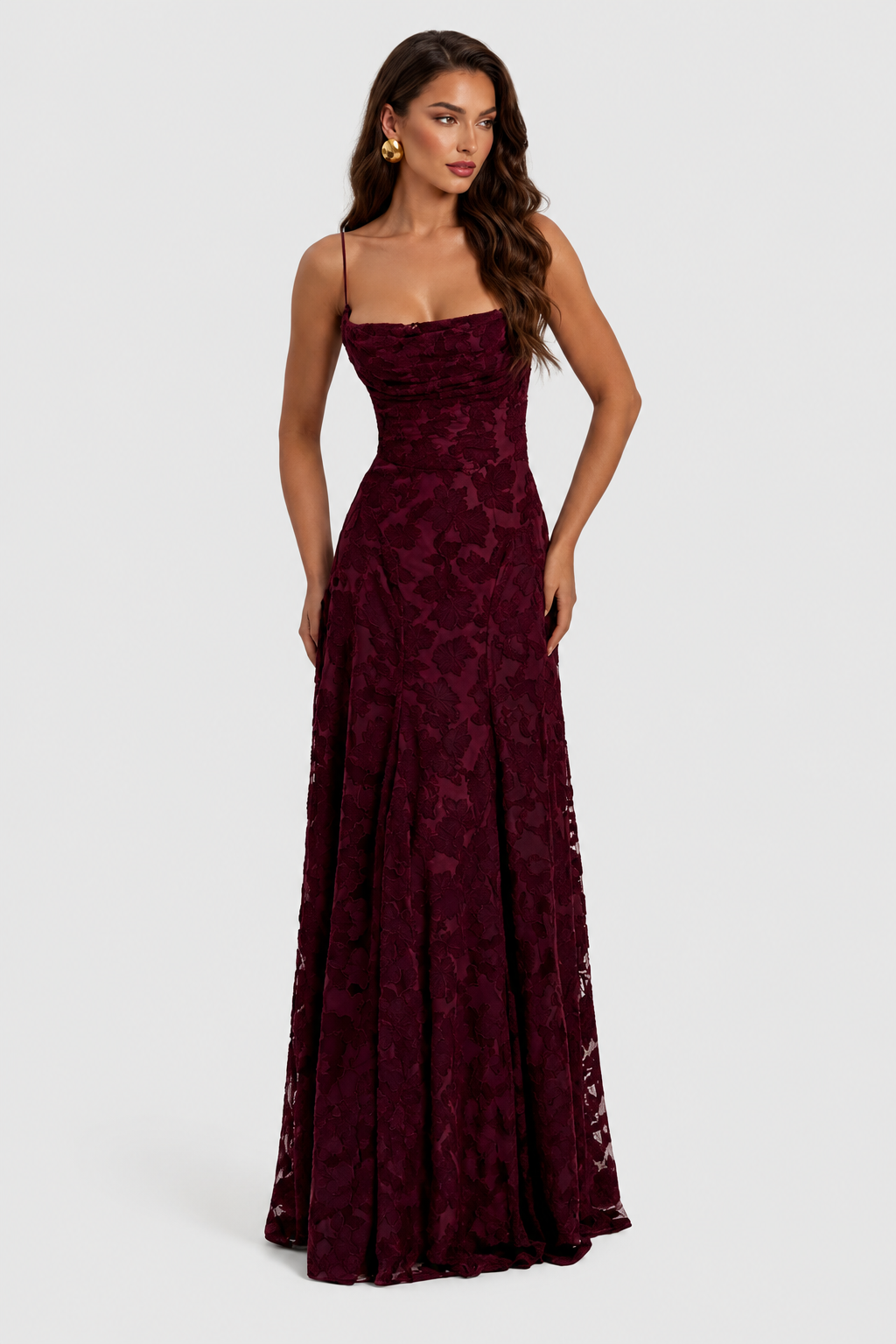 Burgundy floral lace dress with a draped square neckline and thin straps, shown at an angle.