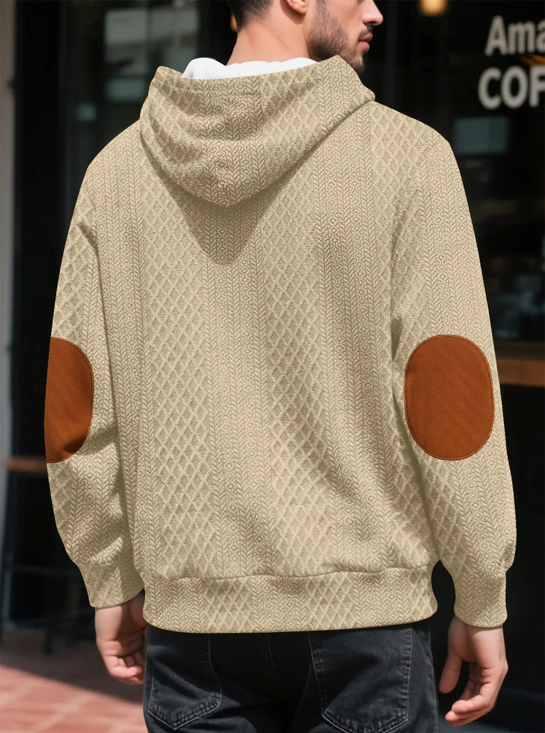 Back view of the beige hoodie on a man, showing large brown elbow patches 27