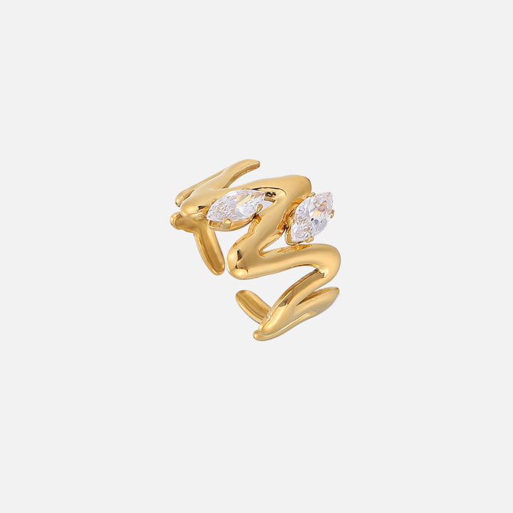 Gold-tone open ring with a wavy, flowing sculpted band and two marquise-cut clear crystals.