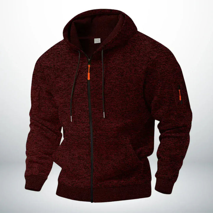Front view of the hoodie in heathered burgundy, showing the drawstrings, kangaroo pocket and zippered sleeve pocket 2