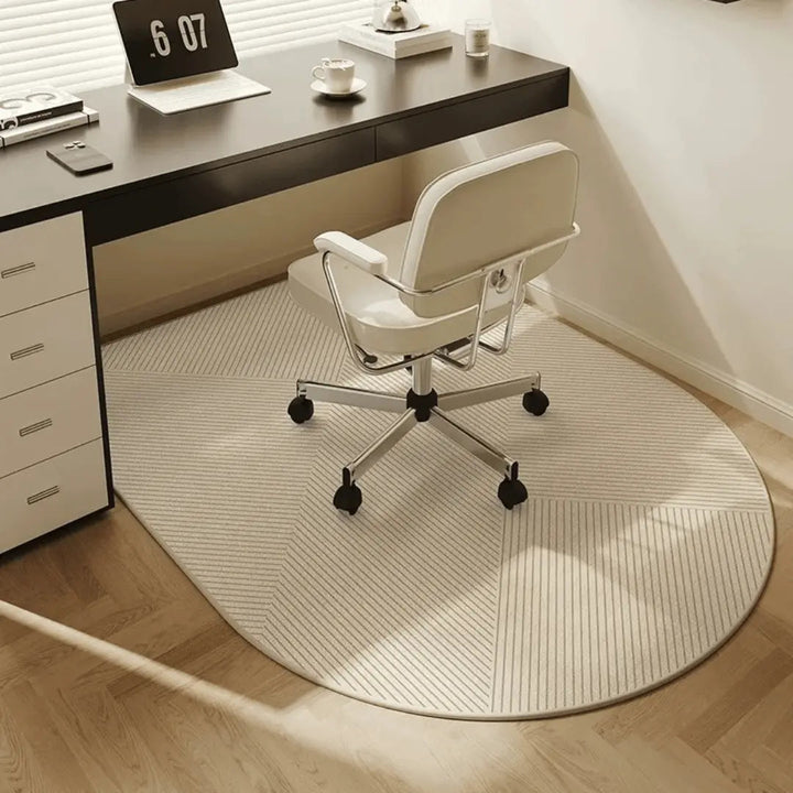 Beige striped mat under a white office chair on casters beside a black desk on a wood floor.