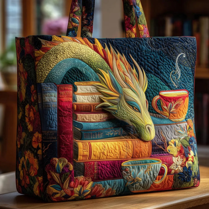 Quilted tote with a dragon resting its head on stacked books beside teacups and flowers