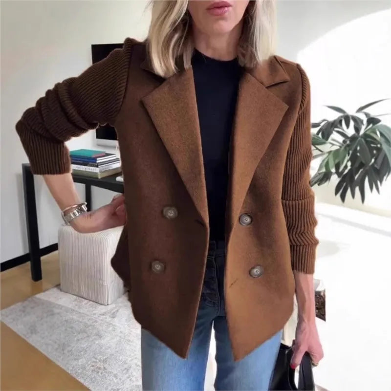 Brown double-breasted jacket with ribbed sleeves, worn with jeans in a living room, hand on hip 2