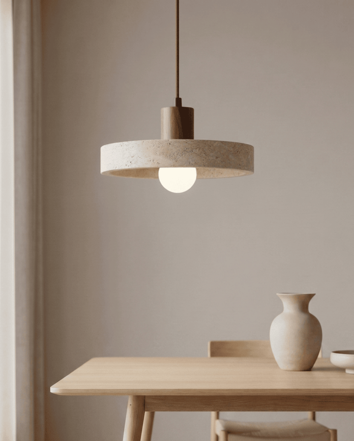 Travertine pendant light, another view, hanging above a light oak dining table.