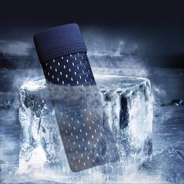 Navy perforated mesh boxer shorts standing upright in a block of ice amid icy mist, suggesting a cooling feel 2