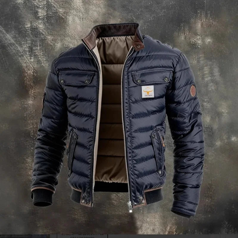 Navy quilted jacket shown open on a weathered gray backdrop, revealing the brown padded lining 2