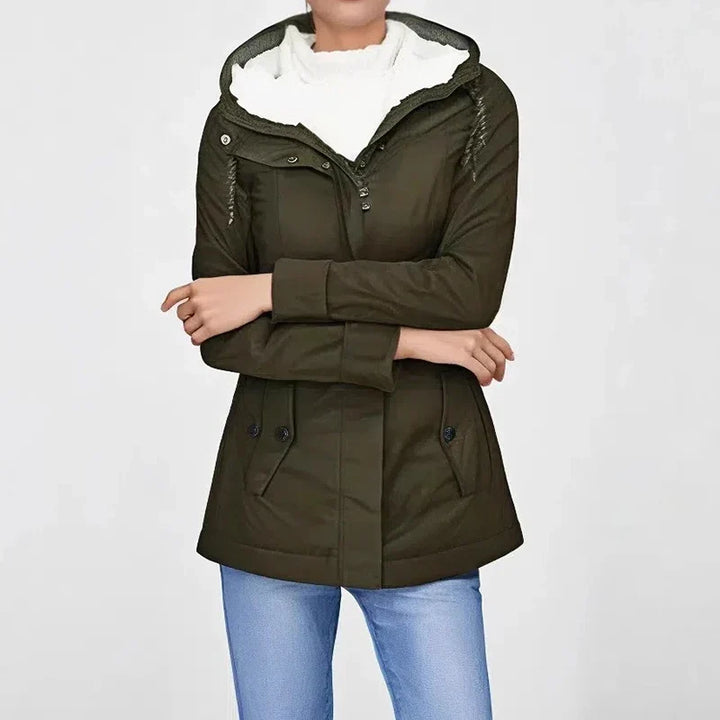 Cropped torso view of an olive green jacket with a cream fleece-lined hood and cuffed sleeves 2