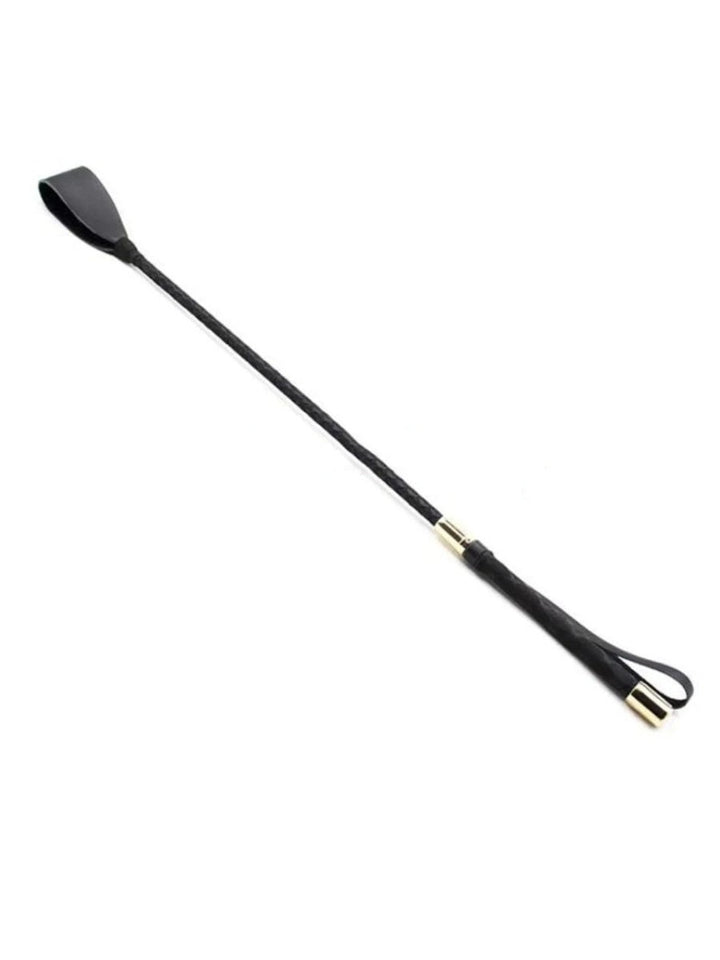Full black riding crop lying diagonally, with a flat leather tip, braided shaft and gold-tone end caps 1
