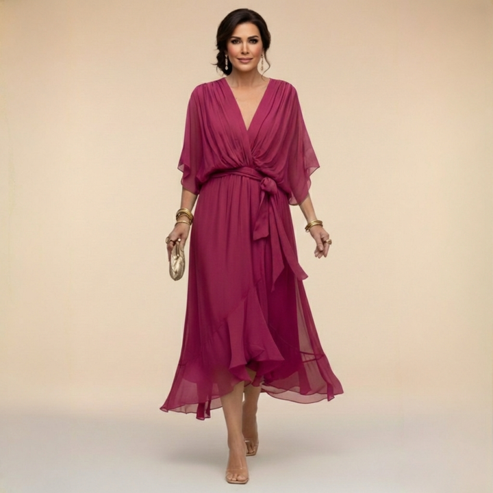 Deep magenta pink midi dress detail with a draped V-neckline and wide sleeves.