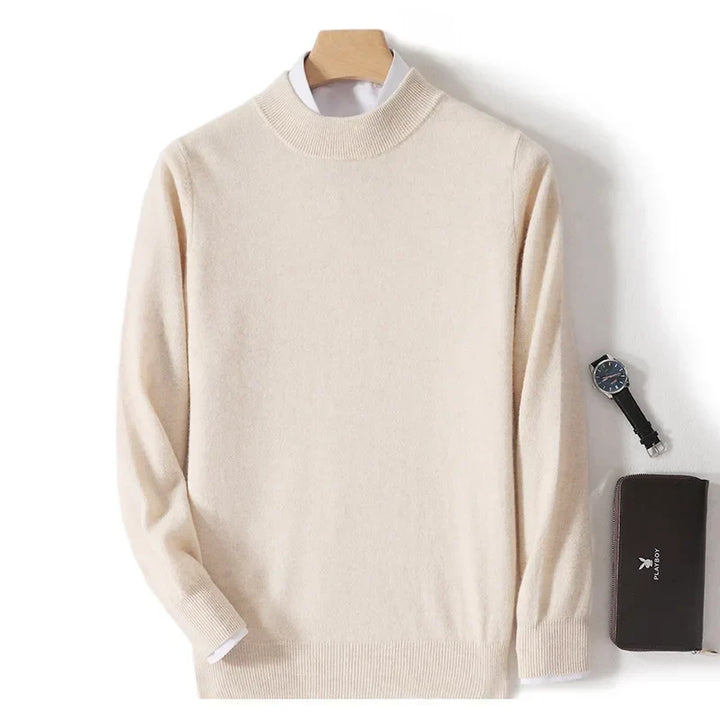 Beige knit sweater on a wooden hanger over a white shirt, with a watch and wallet beside it 2