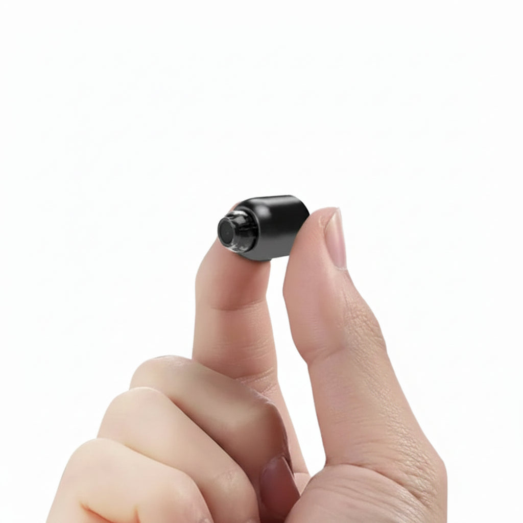 Mini WiFi Security Camera 1080p in black plastic held between fingers