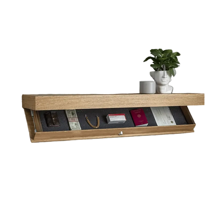 Natural oak floating shelf with a potted plant on top and the compartment open, holding a wallet, cash, a gold bracelet, a passport and papers. 3