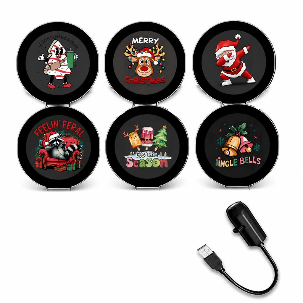 Six round Christmas projection discs beside the black USB projector.