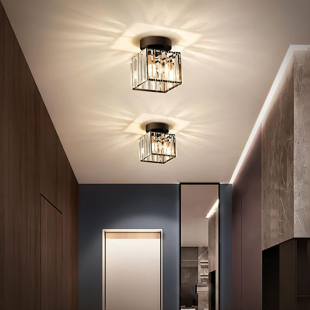 Black square ceiling light in a modern hallway with wood paneling.