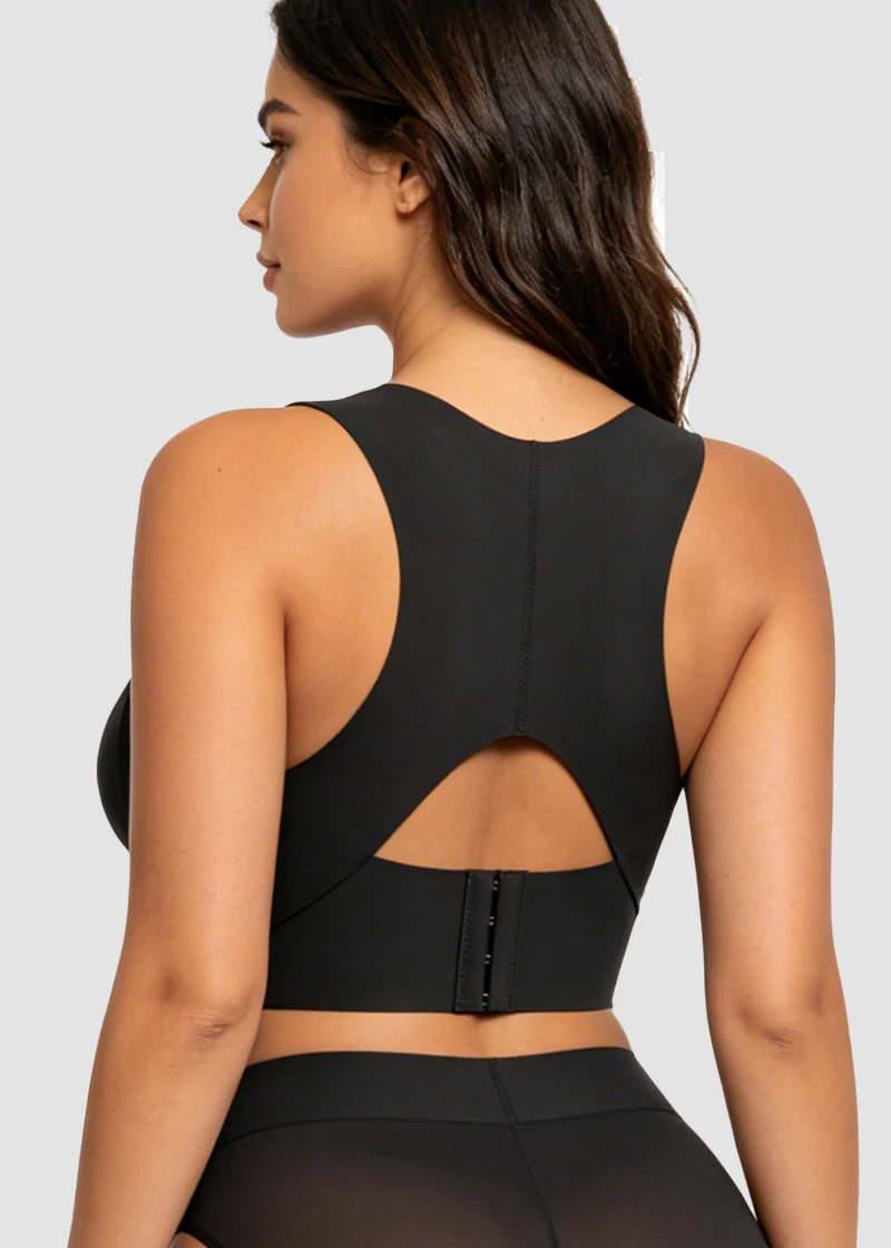 Back view of the black bra on a model, showing the center seam, keyhole cutout and three-row hook closure.