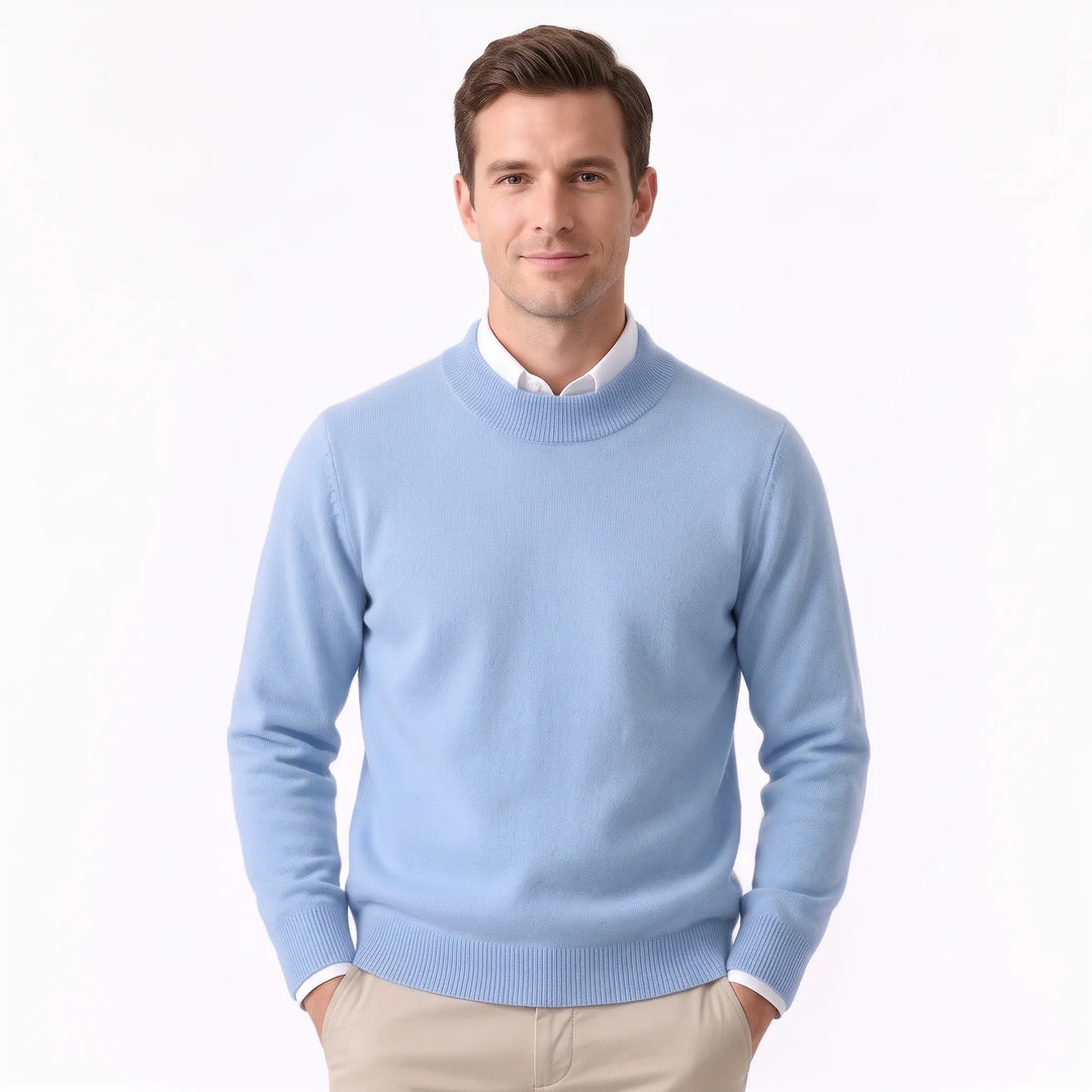Man wearing the pale sky blue sweater over a white collared shirt and khaki pants 31