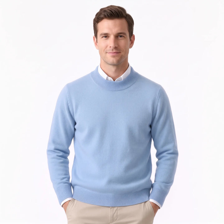 Man wearing the pale sky blue sweater over a white collared shirt and khaki pants 31