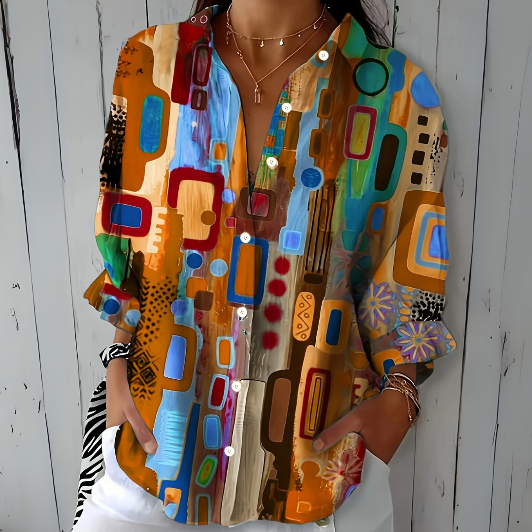 Front view of the orange and tan colorway of the geometric-print blouse.
