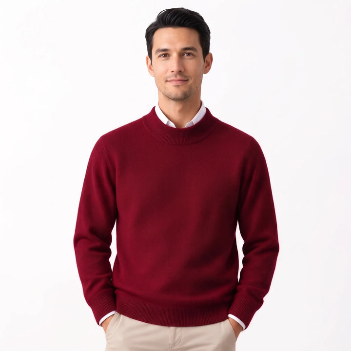 Man wearing the burgundy sweater over a white collared shirt with khaki pants, hands in pockets 33