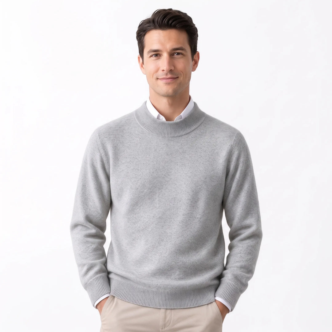 Man wearing the light heather gray sweater over a white collared shirt and khaki pants 34
