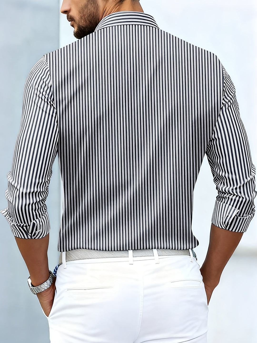 Black and white striped shirt, back view on a model.