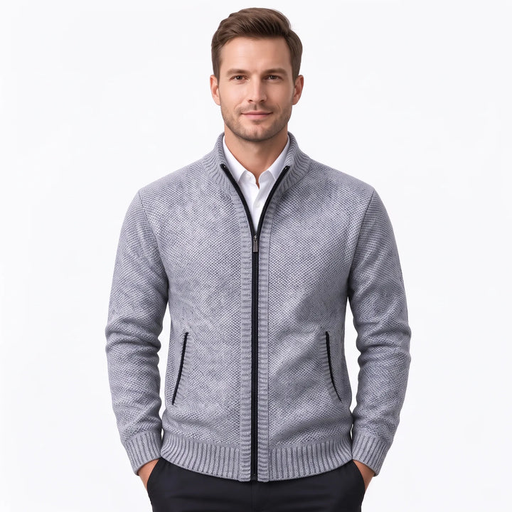Model wearing a light gray knit zip cardigan with black zipper over a white shirt 36