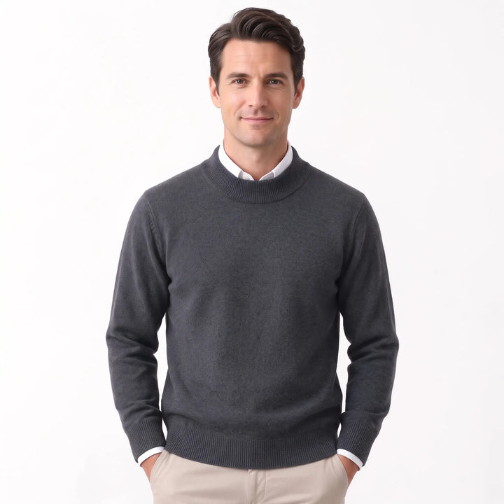 Man wearing the charcoal gray sweater over a white collared shirt with khaki pants 36