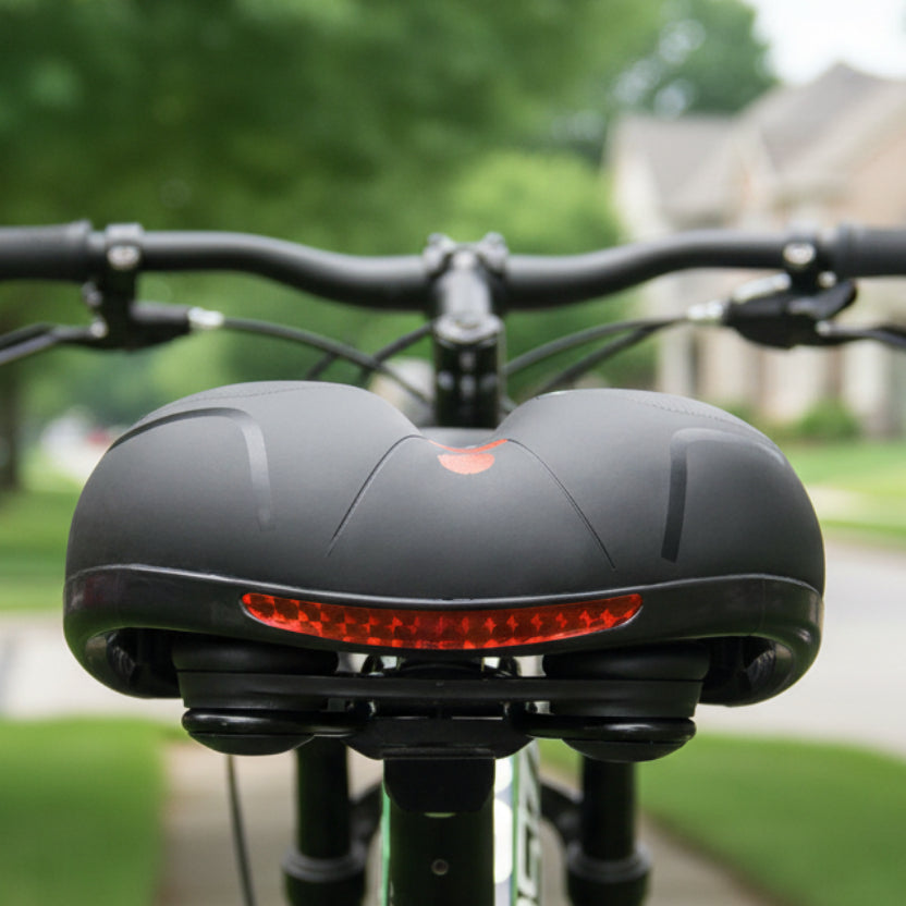 Rear view detail of the black and red saddle with a red reflective strip.