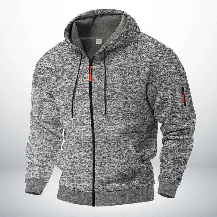 Front view of the hoodie in heathered light gray, with black zipper and orange pull tabs 3