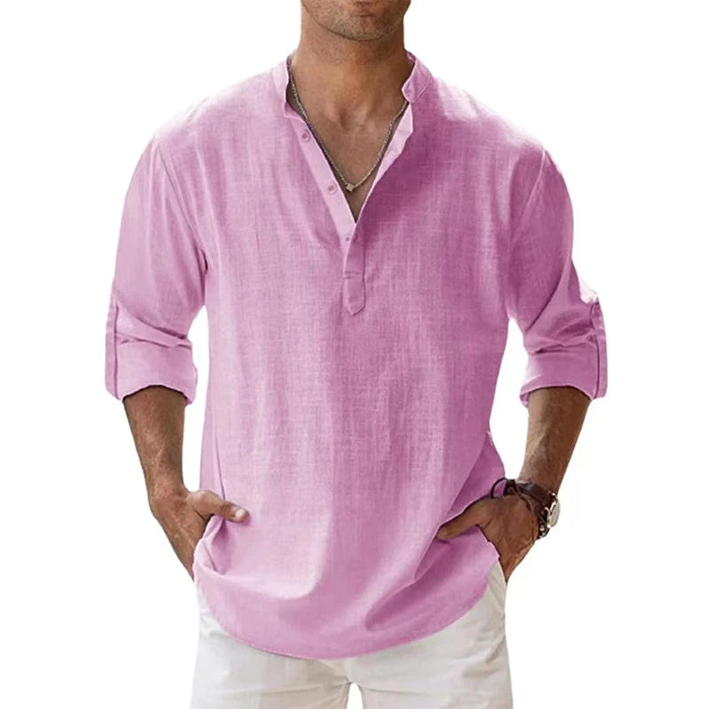Men's linen Henley shirt in light pink with rolled sleeves and a button neck.