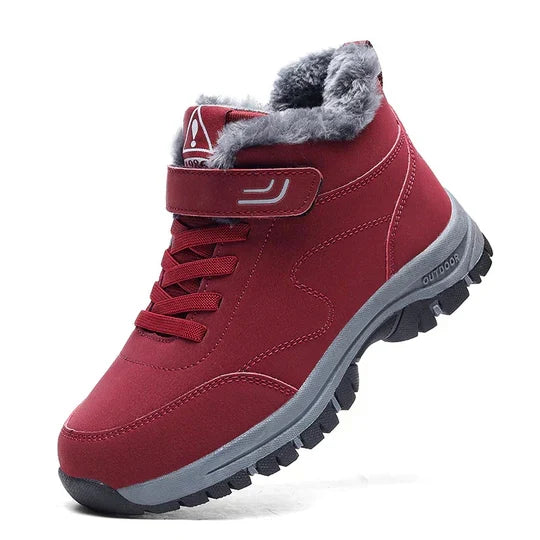 Red high-top boot with gray fleece collar, strap closure, laces and a chunky gray sole 5