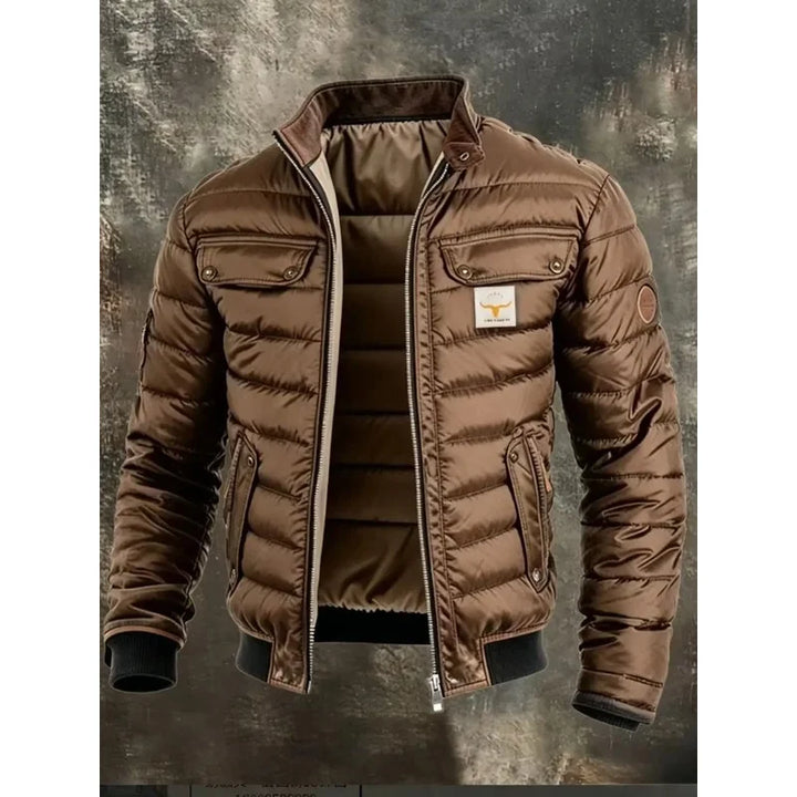 Brown quilted jacket open on a weathered backdrop, showing flap chest pockets and padded lining 3