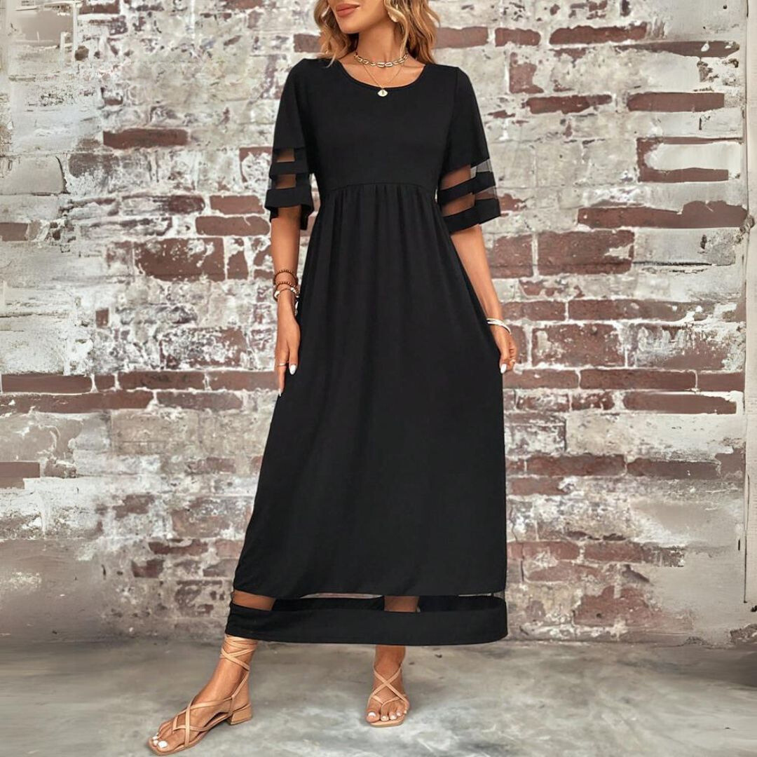 Three-quarter front view of the black maxi dress with round neckline, sheer sleeve stripes and sheer hem band. 4