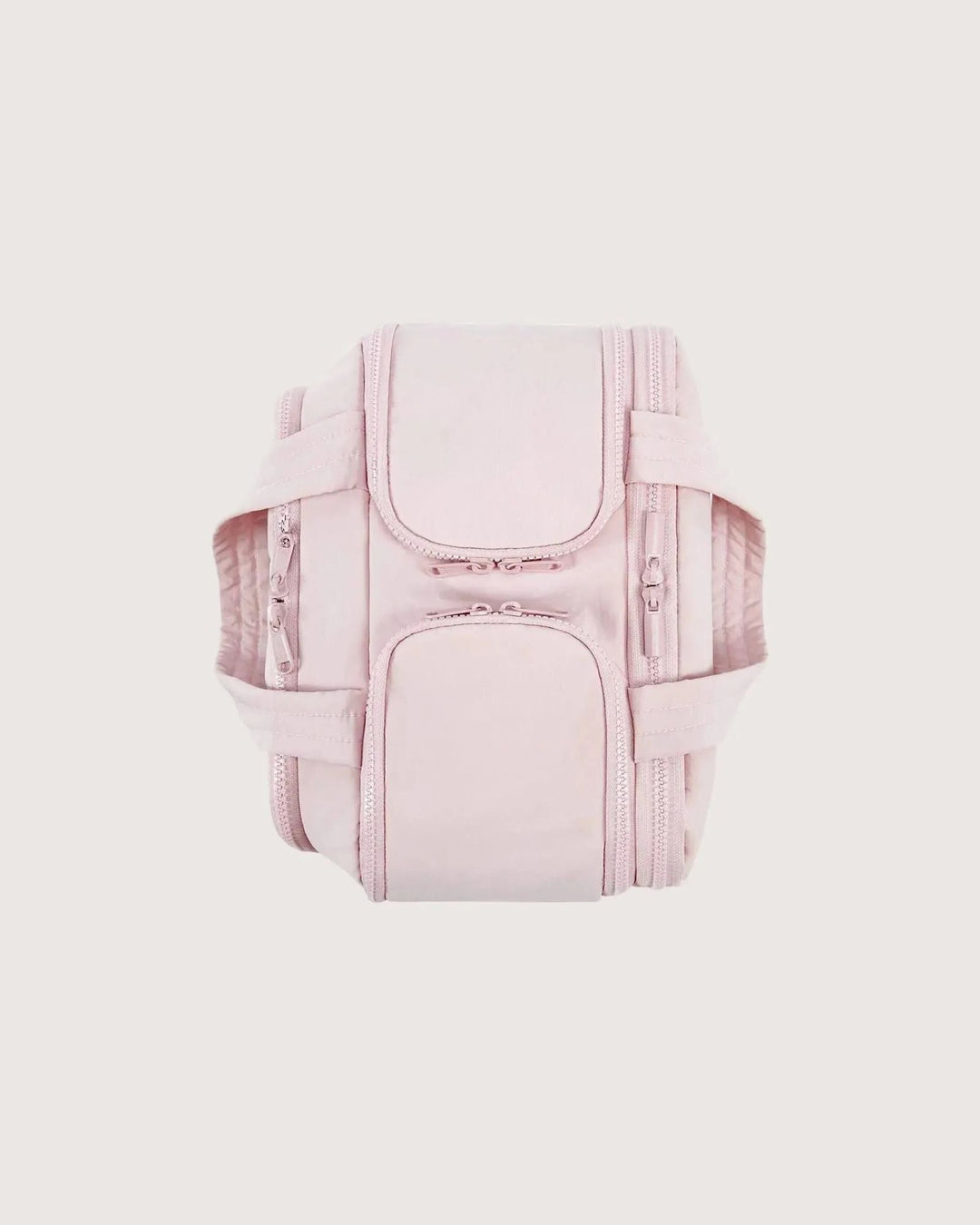 Pink bag seen from above with handles folded flat, showing the zippered pockets on top and both sides.
