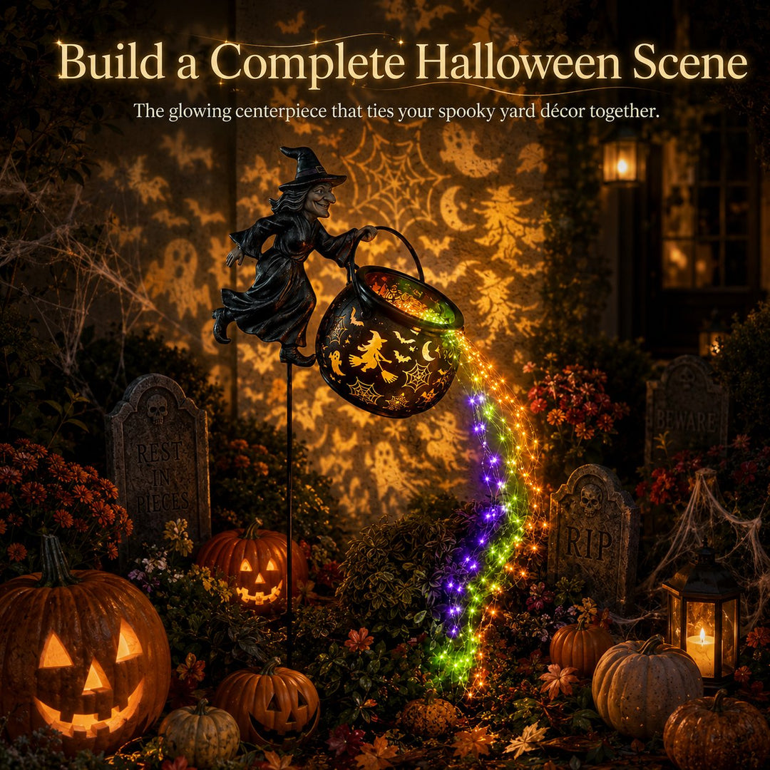 Another view of the witch light as the centerpiece of a Halloween yard scene with gravestones, jack-o'-lanterns, a candle lantern and cobwebs.