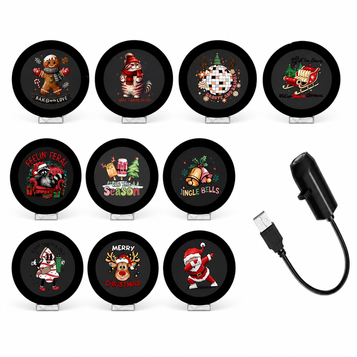 Ten round Christmas projection discs beside the black USB projector.