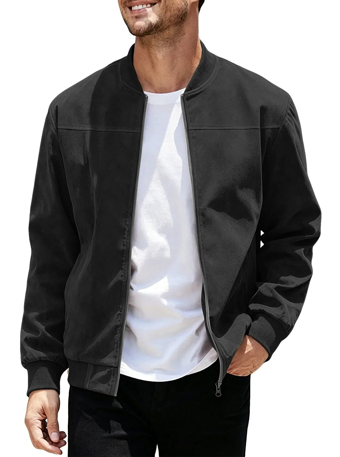 Man wearing the black zip-up bomber open over a white tee, one hand in pocket 42
