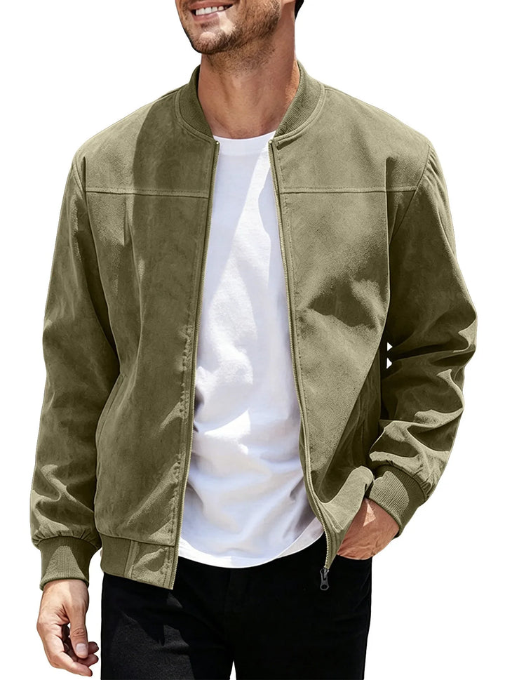 Man wearing the olive green zip-up bomber open over a white tee, hand in pocket 46