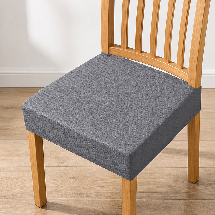 Gray textured seat cover on a light wood chair, another view.