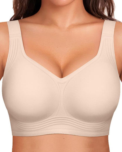 Front view of the bra in light blush beige with smooth cups and ribbed lines along the straps and band. 8