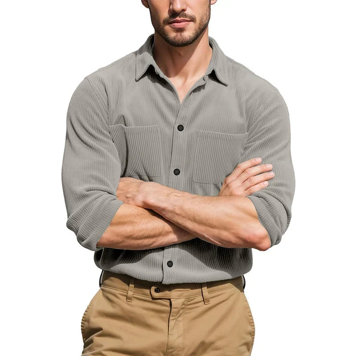 Model with arms crossed wearing the gray ribbed shirt with rolled sleeves and khaki pants 4