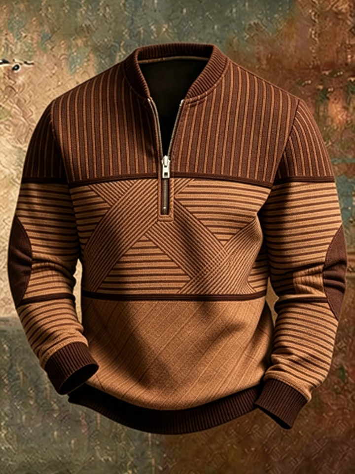 Brown and tan half-zip sweater with vertical ribbing on top, geometric striped chest panel and dark brown elbow patches.
