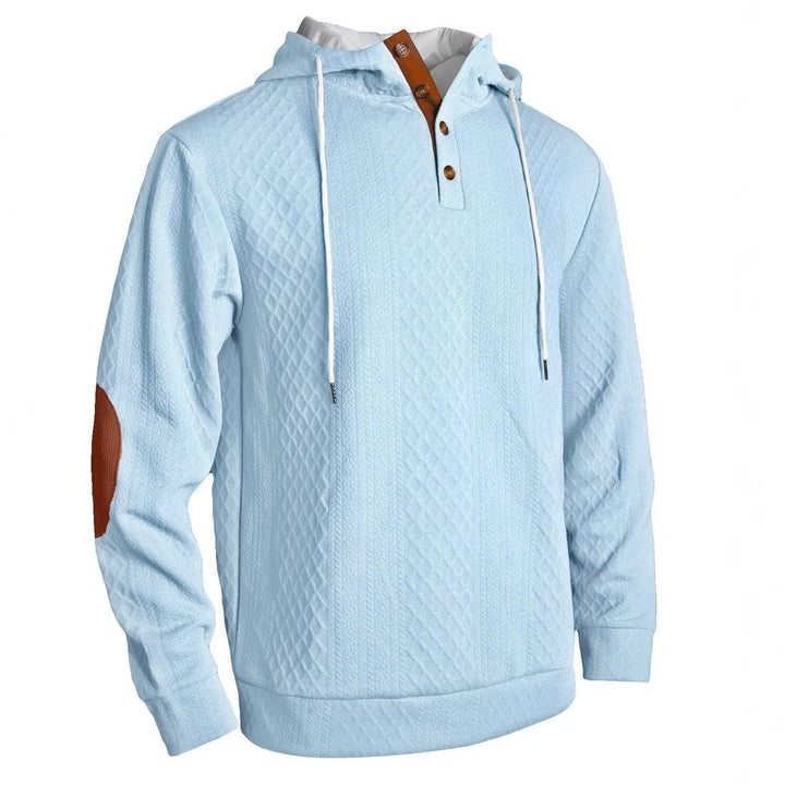 Light blue diamond-textured hoodie on a white background, angled view with brown elbow patch and button placket 4