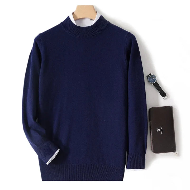 Navy blue knit sweater on a hanger with a white shirt underneath, watch and wallet alongside 4