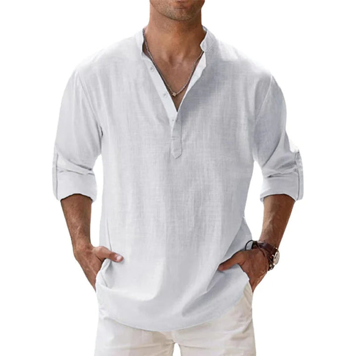 Men's linen Henley shirt in white with rolled sleeves and a short button placket.