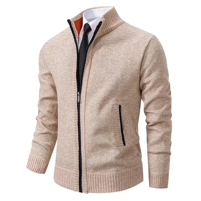 Beige knit zip cardigan at an angle with black zipper trim and an orange collar lining 4